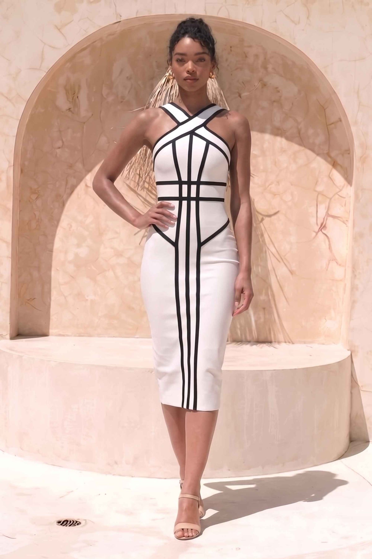 Woman wearing a figure flattering Suki Bandage Midi Dress - White Pearl BODYCON COLLECTION