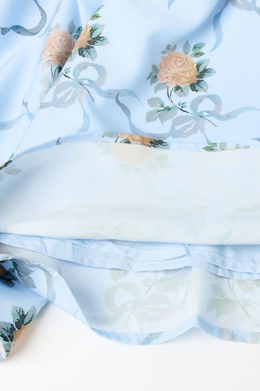 Woman wearing a figure flattering Tasmin Bodycon Midi Dress - Sky Blue BODYCON COLLECTION