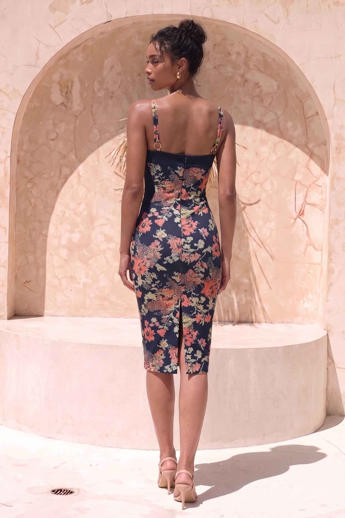 Woman wearing a figure flattering Tate Bodycon Wrap Dress - Classic Black BODYCON COLLECTION Pty Ltd