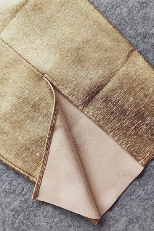 Woman wearing a figure flattering Tyler Bodycon Dress - Gold BODYCON COLLECTION Pty Ltd