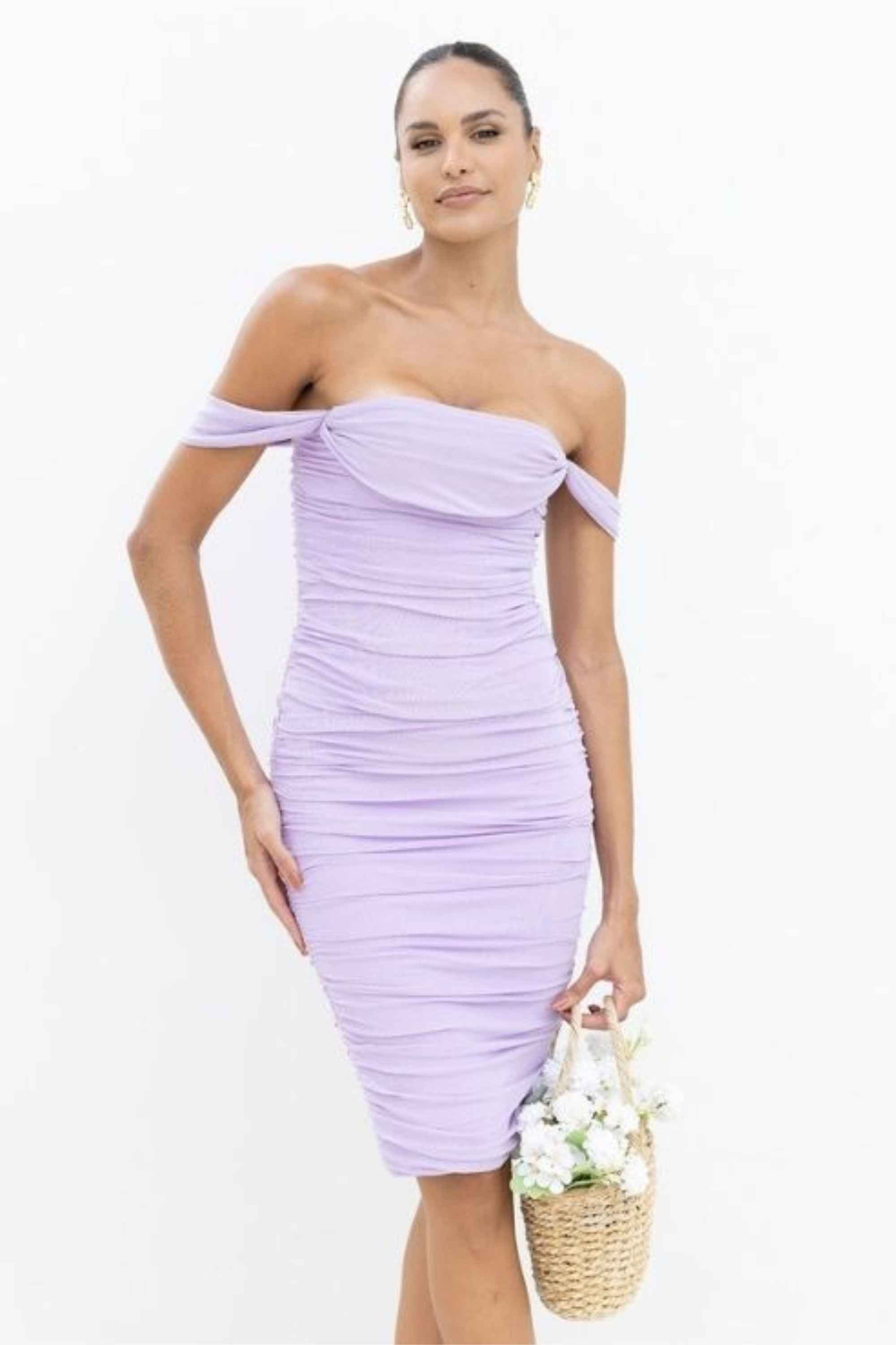 Woman wearing a figure flattering Zia Bodycon Wrap Dress - White Pearl Bodycon Collection