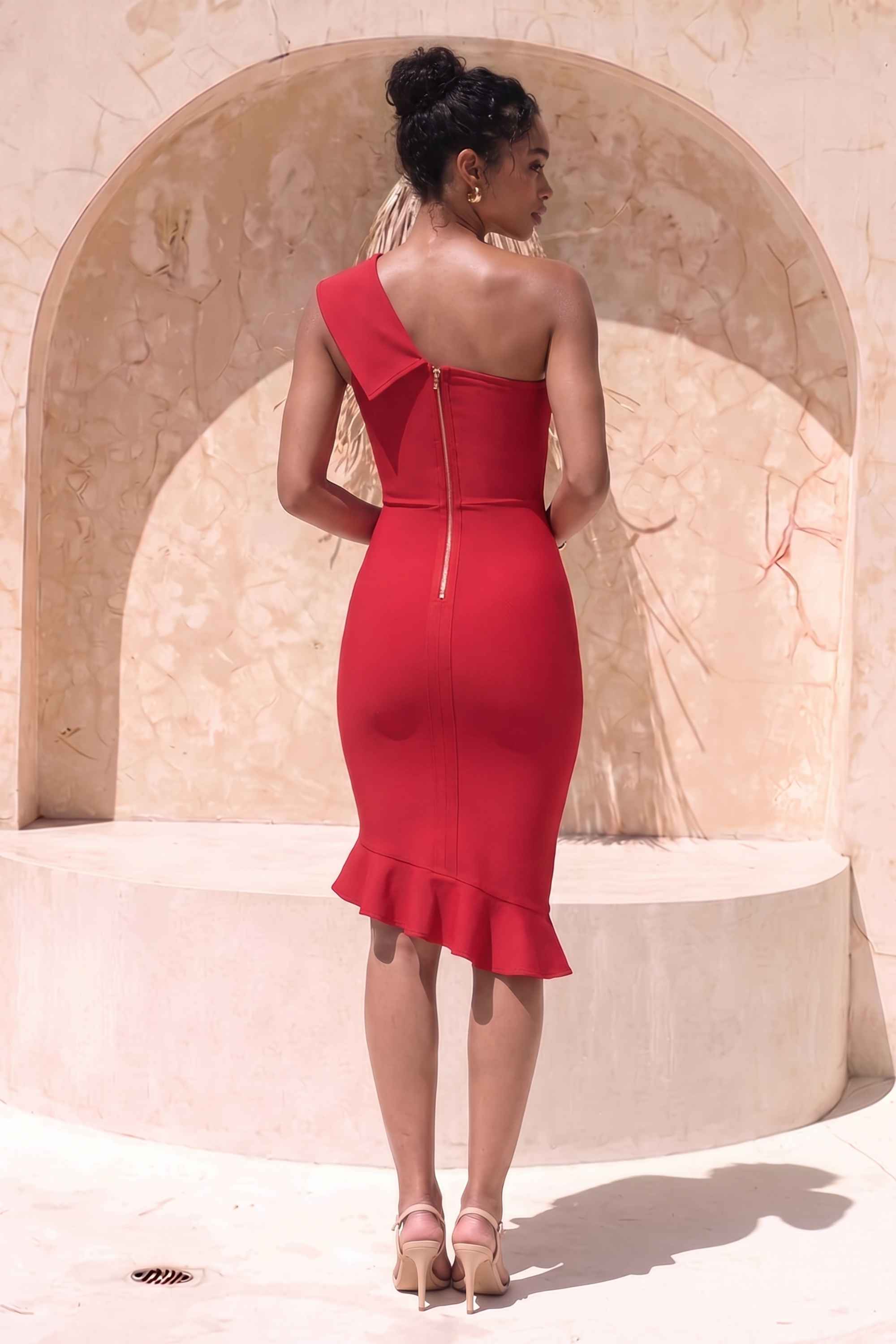 Woman wearing a figure flattering  Avery Bandage Dress - Red Wine BODYCON COLLECTION