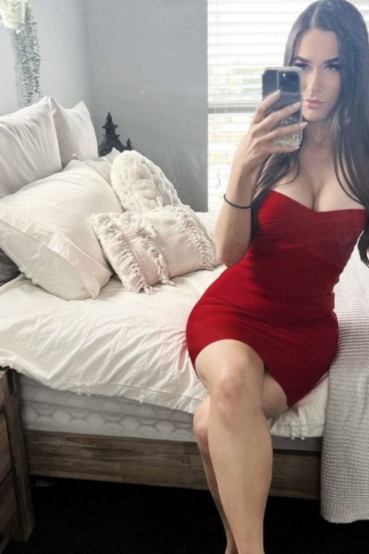 Woman wearing a figure flattering  Aaliyah Bandage Mini Dress - Lipstick Red BODYCON COLLECTION