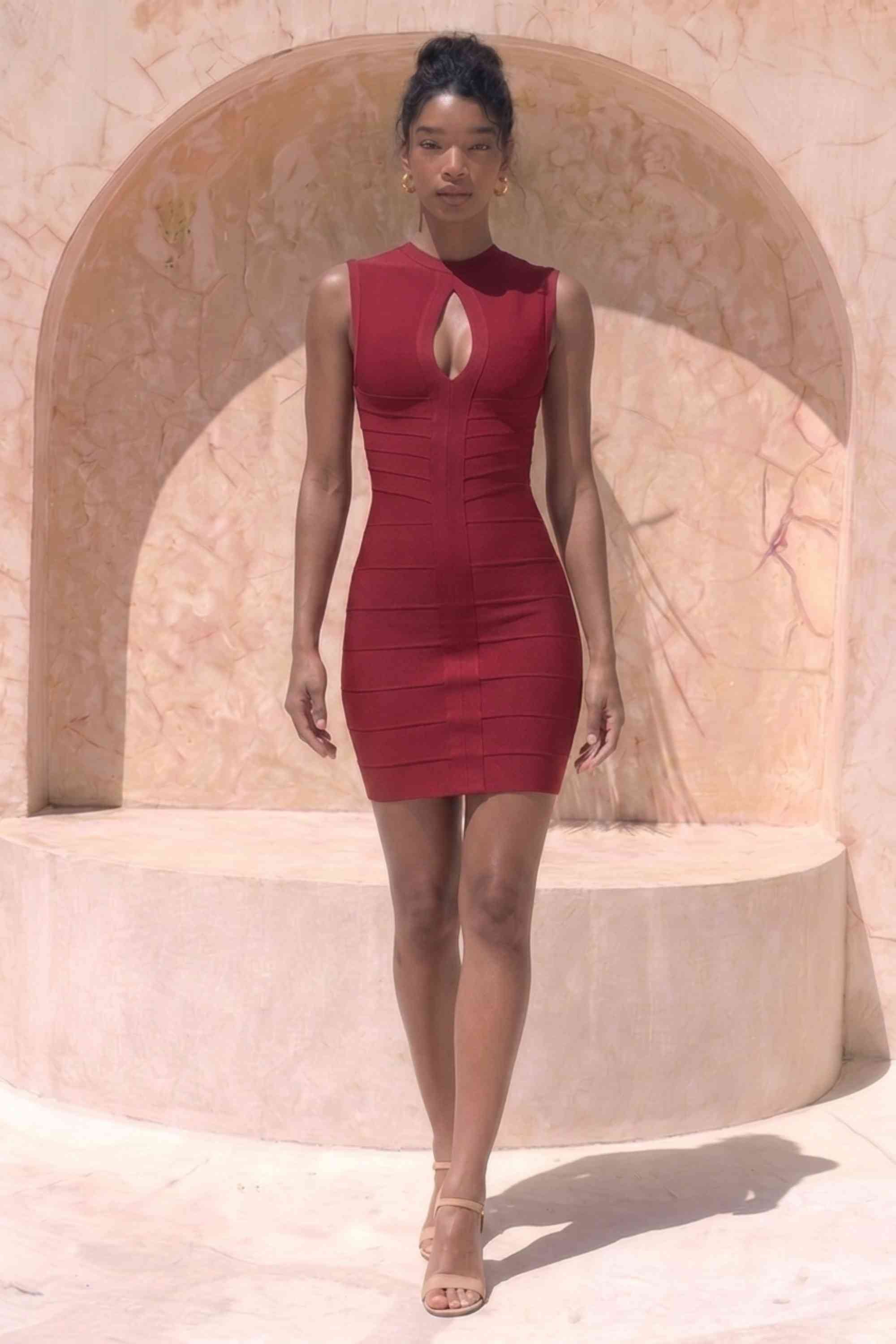 Woman wearing a figure flattering  Alora Bandage Mini Dress - Red Wine BODYCON COLLECTION Pty Ltd
