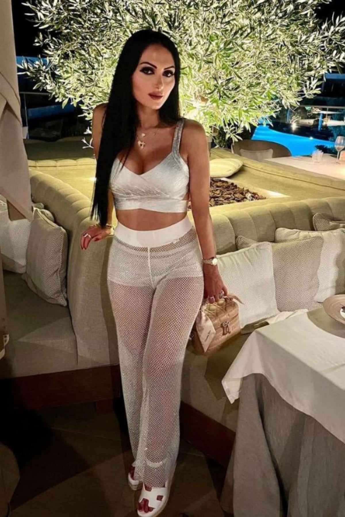 Woman wearing a figure flattering  Ang Bandage Leather Crop Top - Gold BODYCON COLLECTION