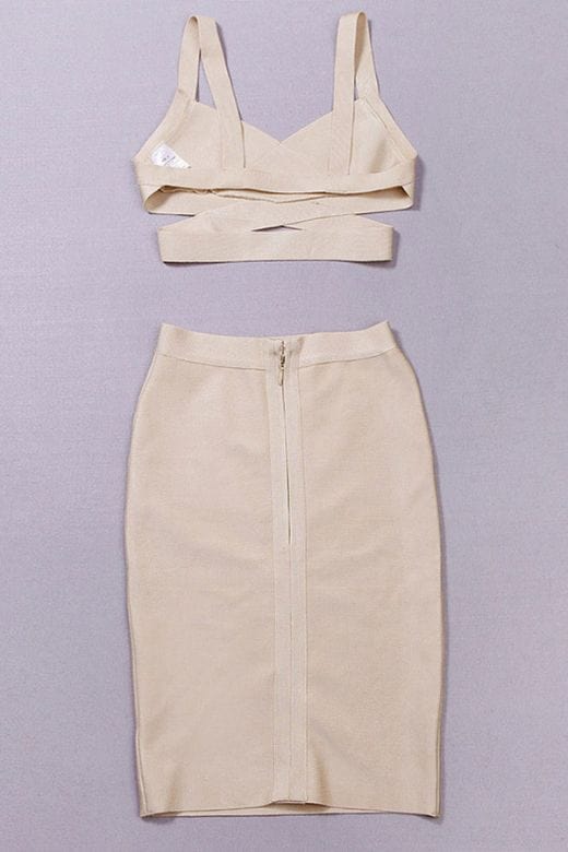 Woman wearing a figure flattering  Ang Bandage Top and Knee Length Skirt Set- Cream BODYCON COLLECTION