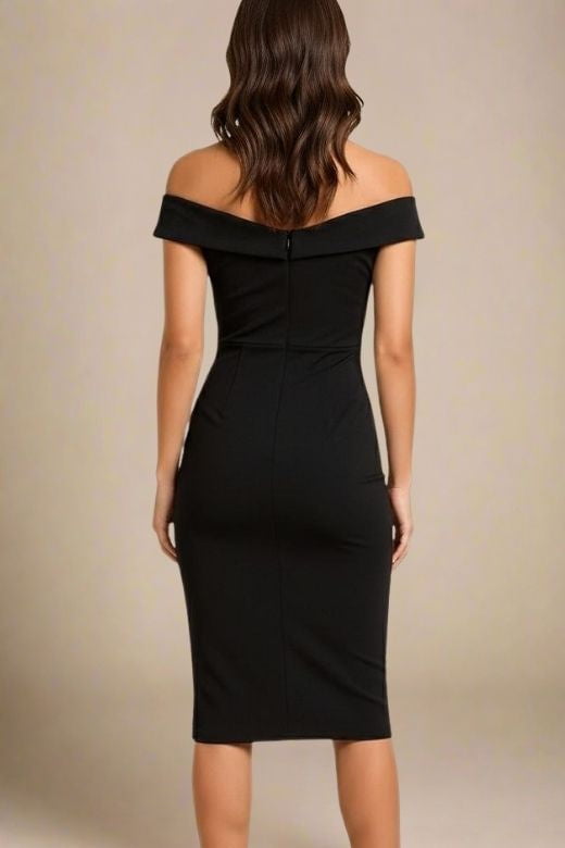 Woman wearing a figure flattering  Ash Bandage Dress - Classic Black Bodycon Collection