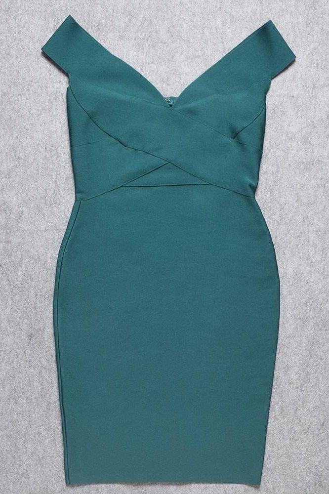 Woman wearing a figure flattering  Ash Bandage Dress - Emerald Green Bodycon Collection