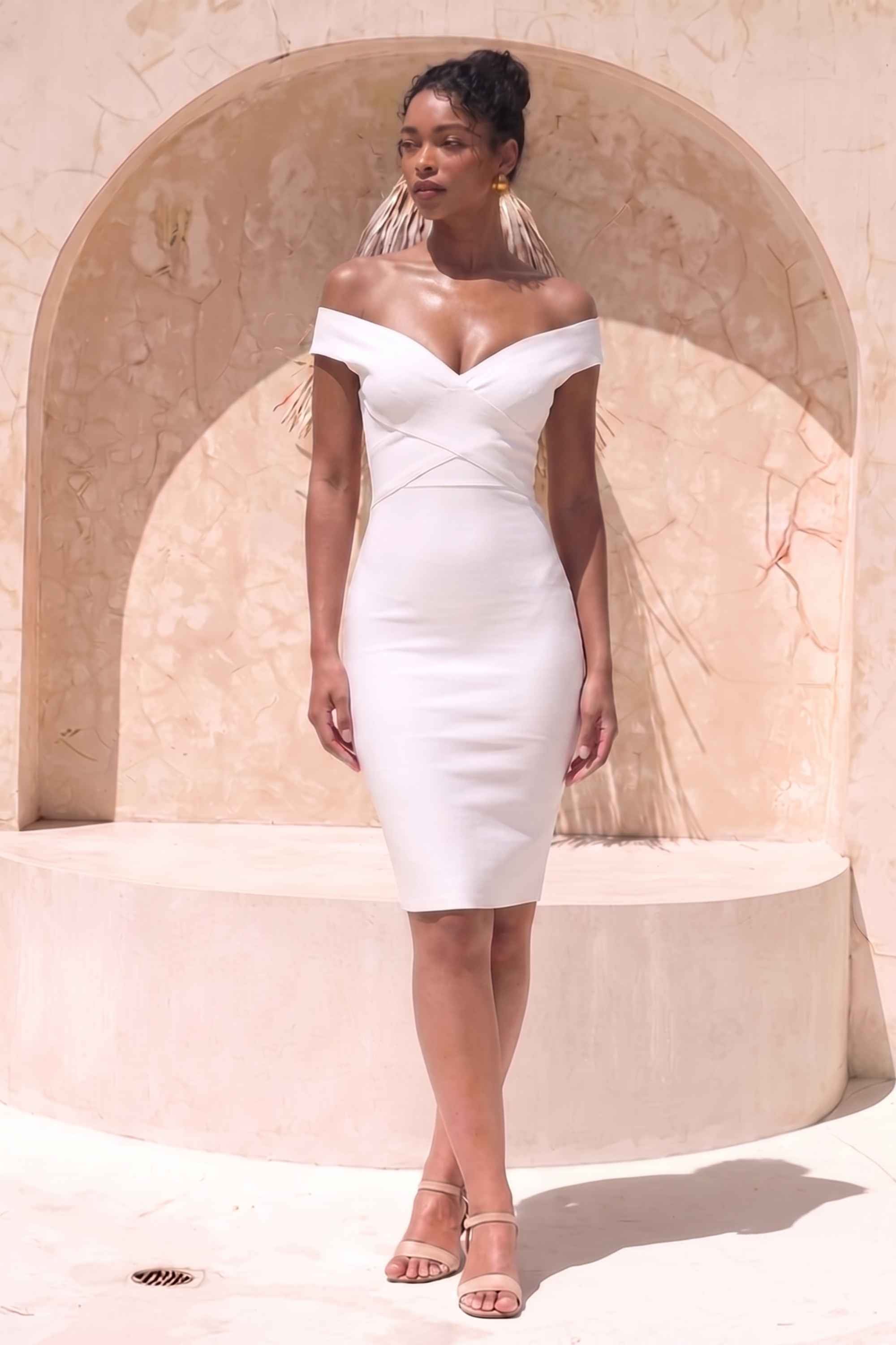Woman wearing a figure flattering  Ash Bandage Dress - White Pearl Bodycon Collection