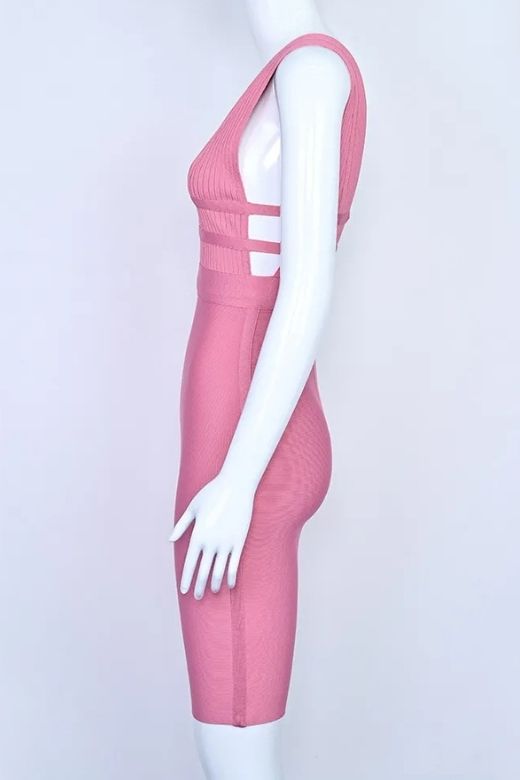 Woman wearing a figure flattering  Bay Bandage Dress - Ballet Pink Bodycon Collection
