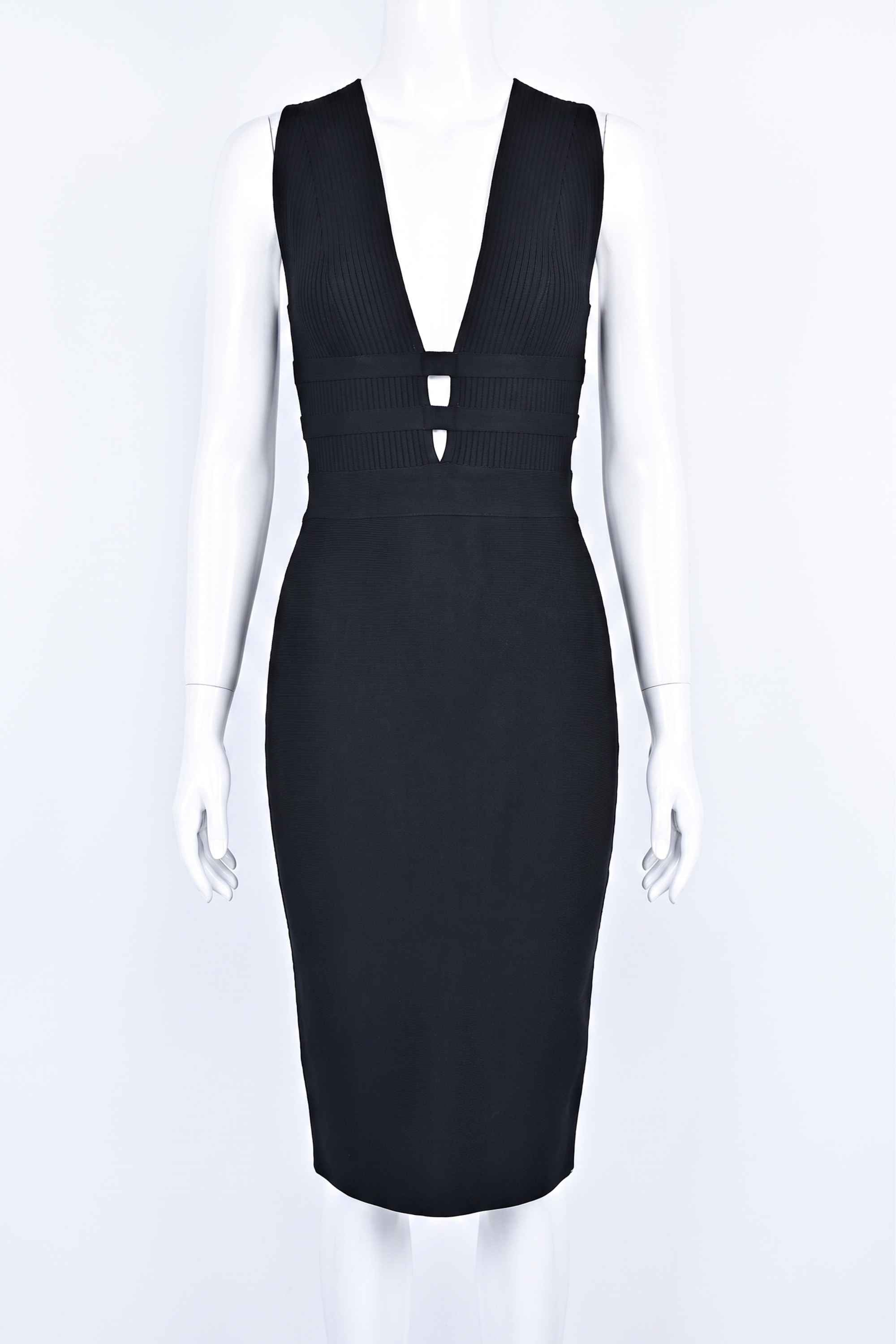 Woman wearing a figure flattering  Bay Bandage Dress - Classic Black Bodycon Collection