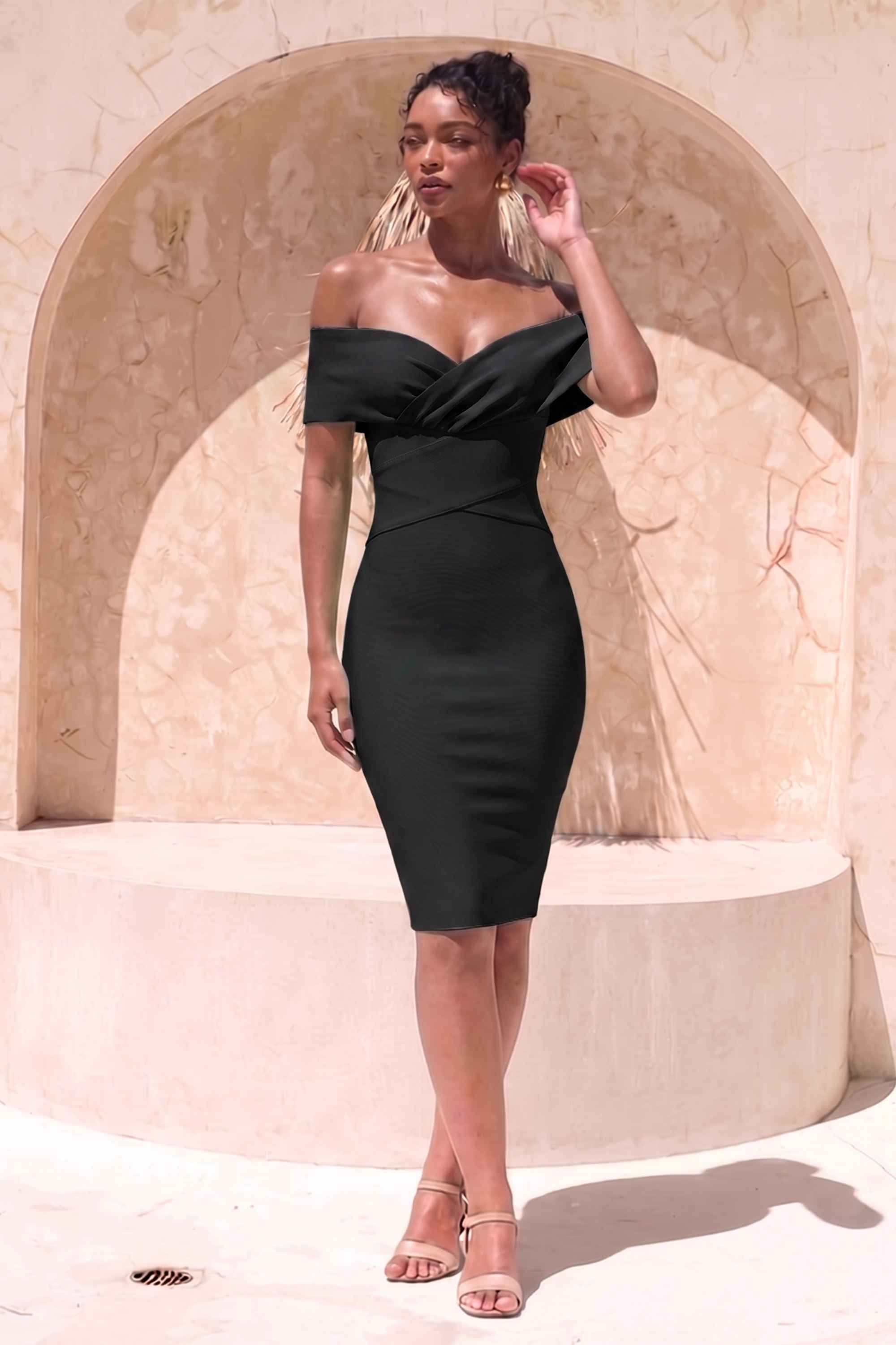 Woman wearing a figure flattering  Bea Bandage Dress - Classic Black Bodycon Collection