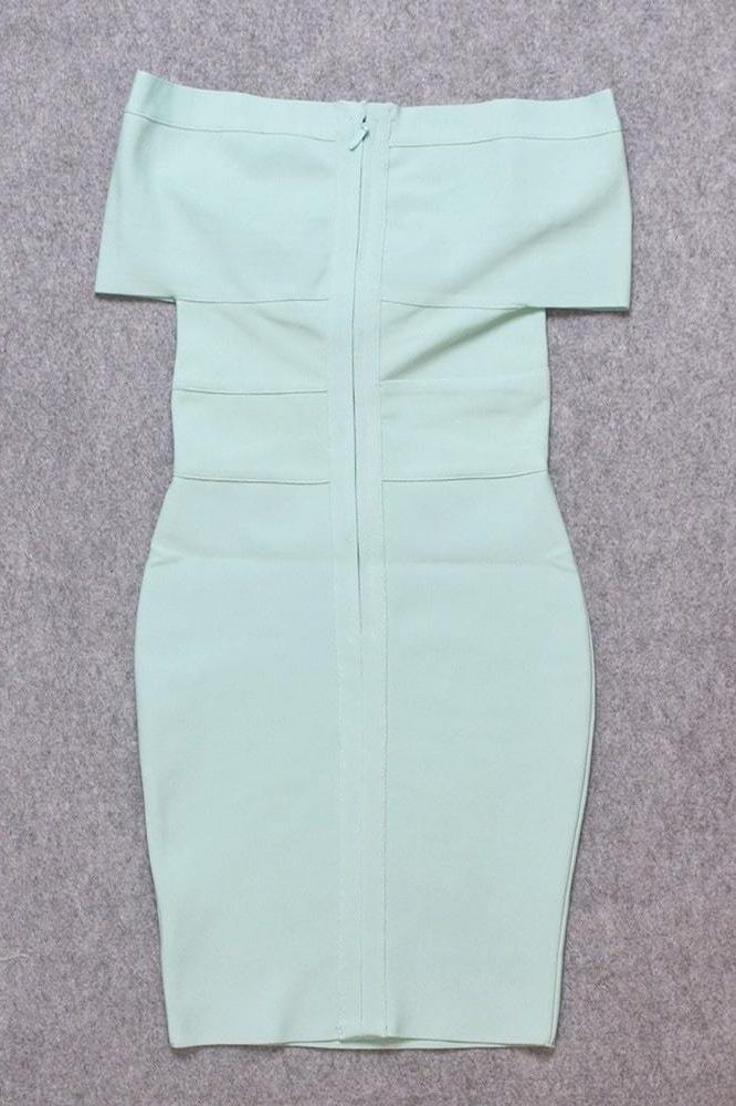 Woman wearing a figure flattering  Bea Bandage Dress - Mint Green Bodycon Collection