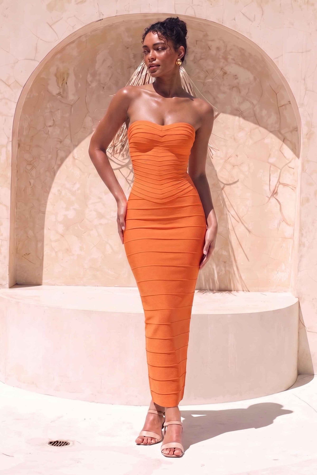 Woman wearing a figure flattering  Belle Bandage Maxi Dress - Apricot Orange BODYCON COLLECTION Pty Ltd