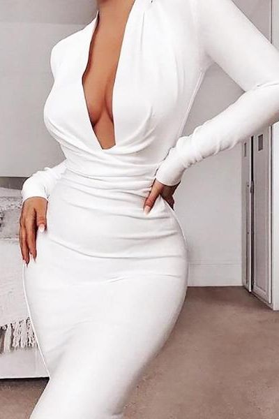 Woman wearing a figure flattering  Blaire Long Sleeve Bandage Dress - Tan Brown BODYCON COLLECTION