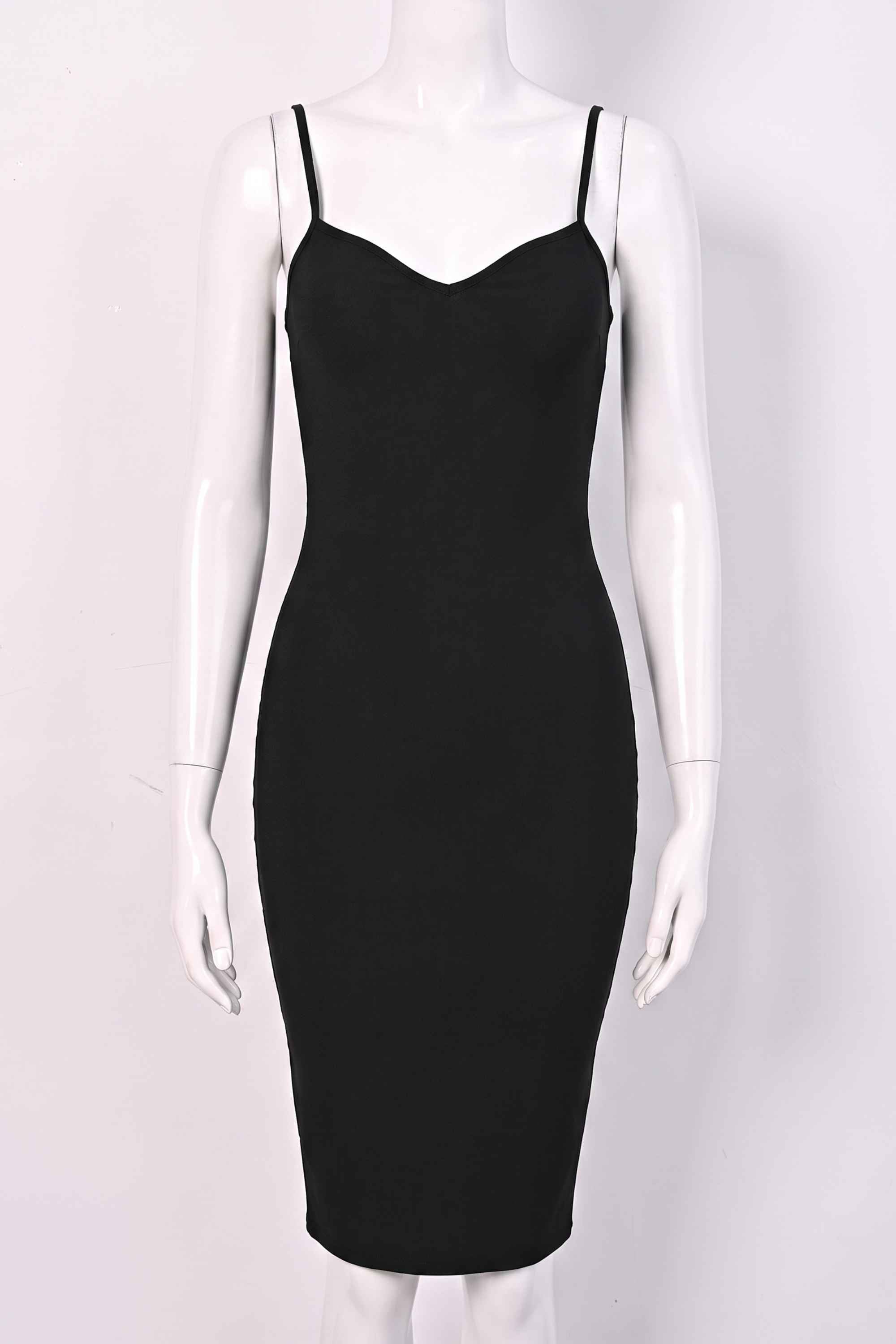 Woman wearing a figure flattering  Blanche Bandage Midi Dress - Classic Black BODYCON COLLECTION