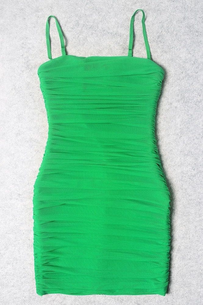 Woman wearing a figure flattering  Cassie Bodycon Wrap Mini Dress - Emerald Green BODYCON COLLECTION