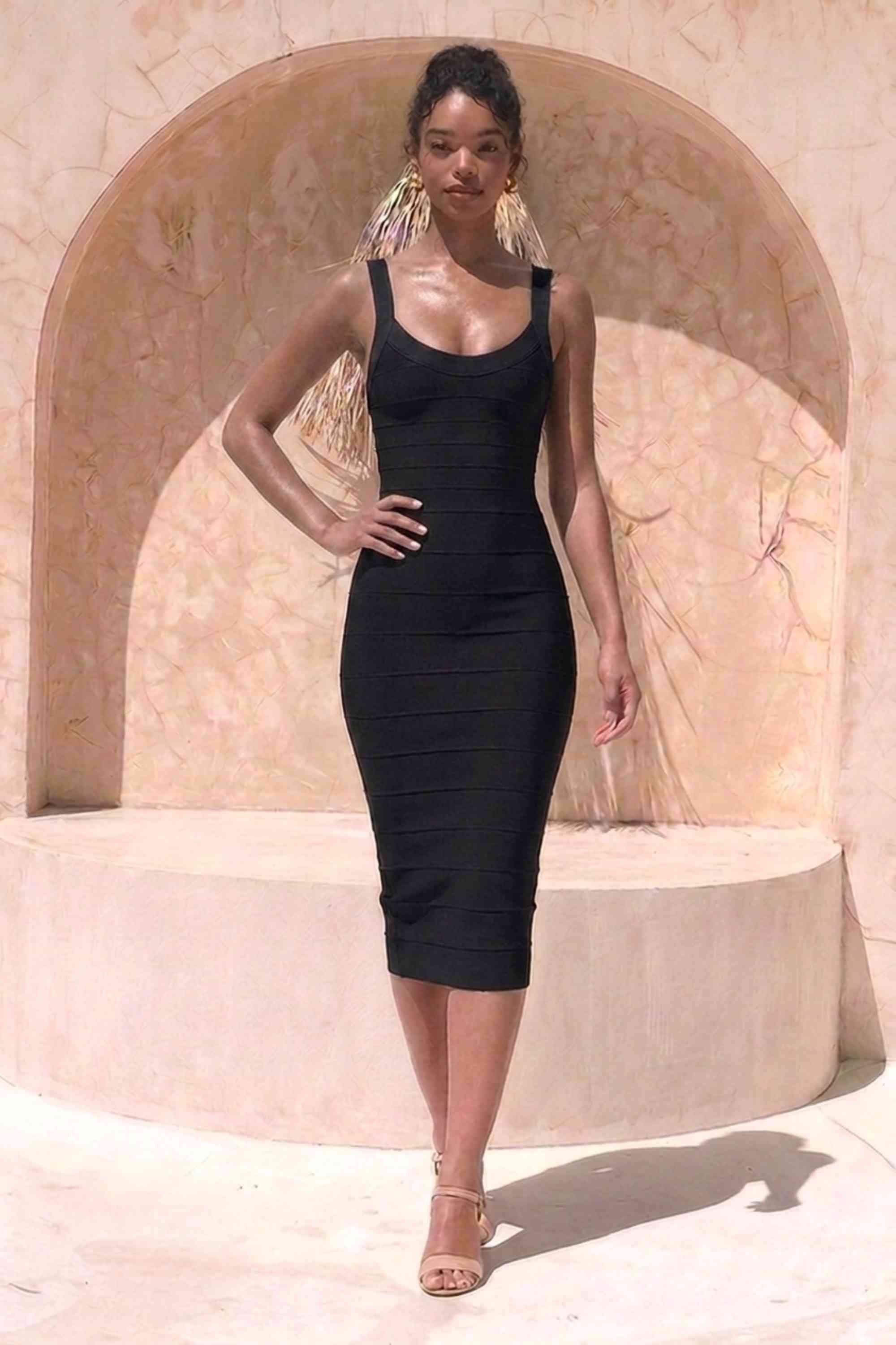 Woman wearing a figure flattering  Cindy Bandage Midi Dress - Classic Black BODYCON COLLECTION Pty Ltd