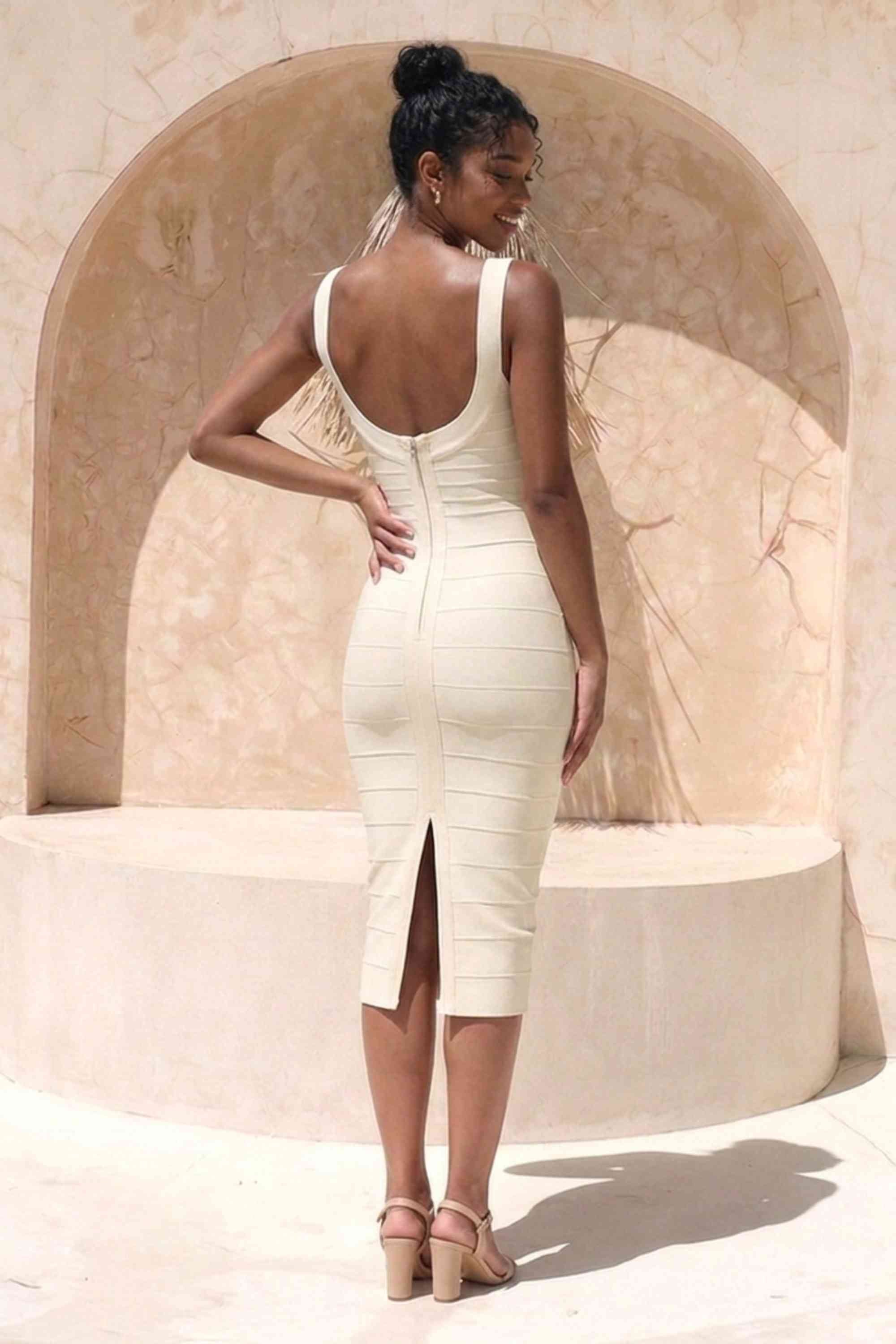 Woman wearing a figure flattering  Cindy Bandage Midi Dress - Cream BODYCON COLLECTION Pty Ltd