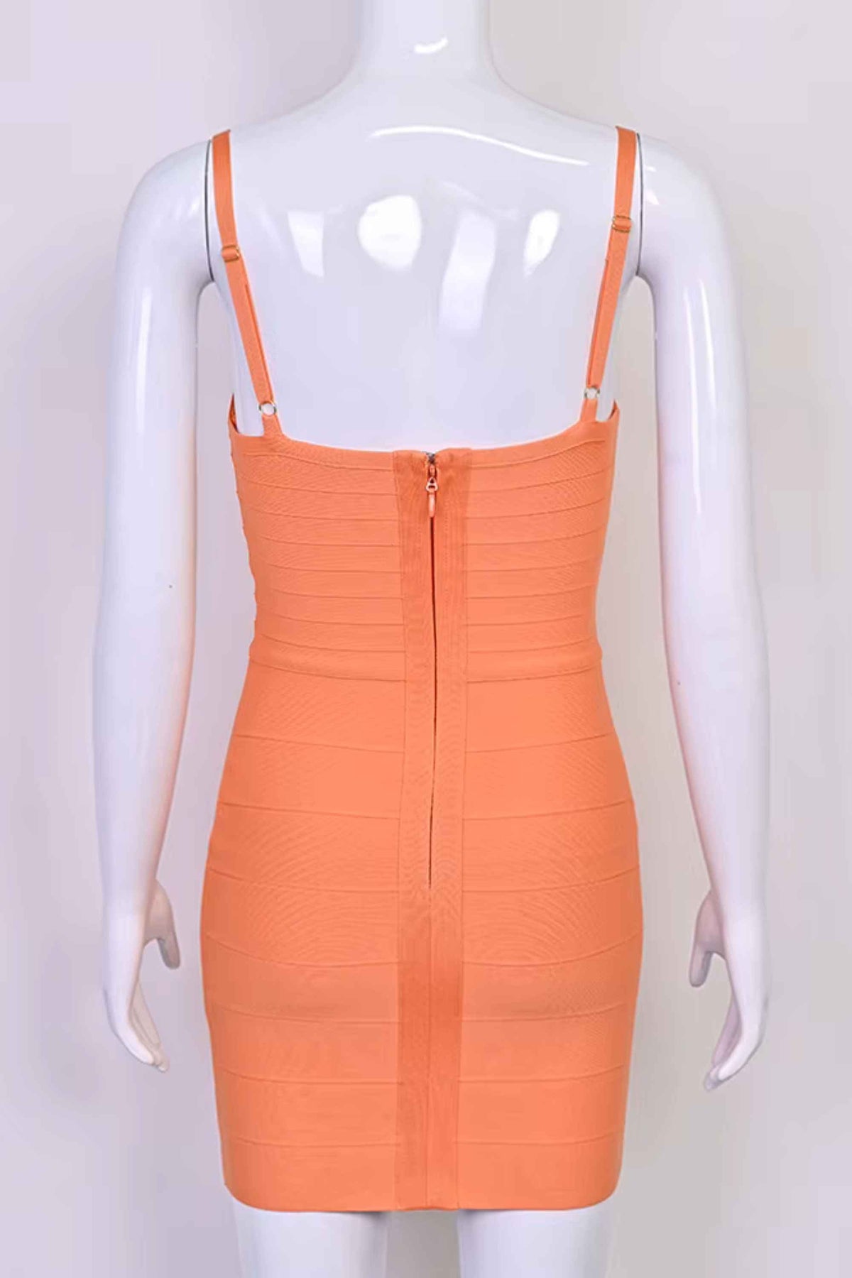 Woman wearing a figure flattering  Dom Bandage Mini Dress - Coral BODYCON COLLECTION Pty Ltd