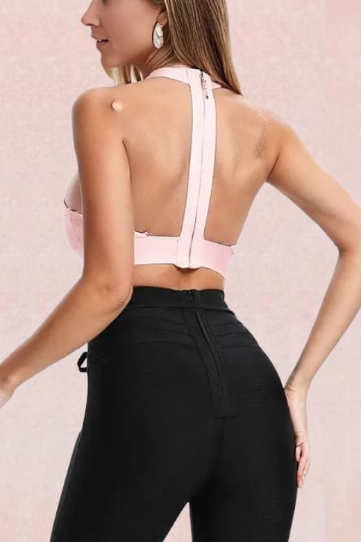 Woman wearing a figure flattering  Elli Bandage Crop Top - Dusty Pink BODYCON COLLECTION