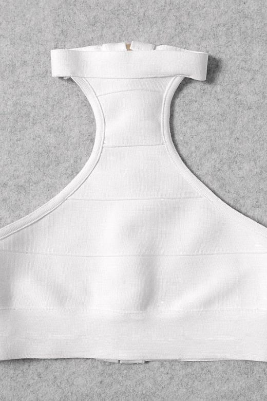 Woman wearing a figure flattering  Elli Bandage Crop Top - Pearl White BODYCON COLLECTION