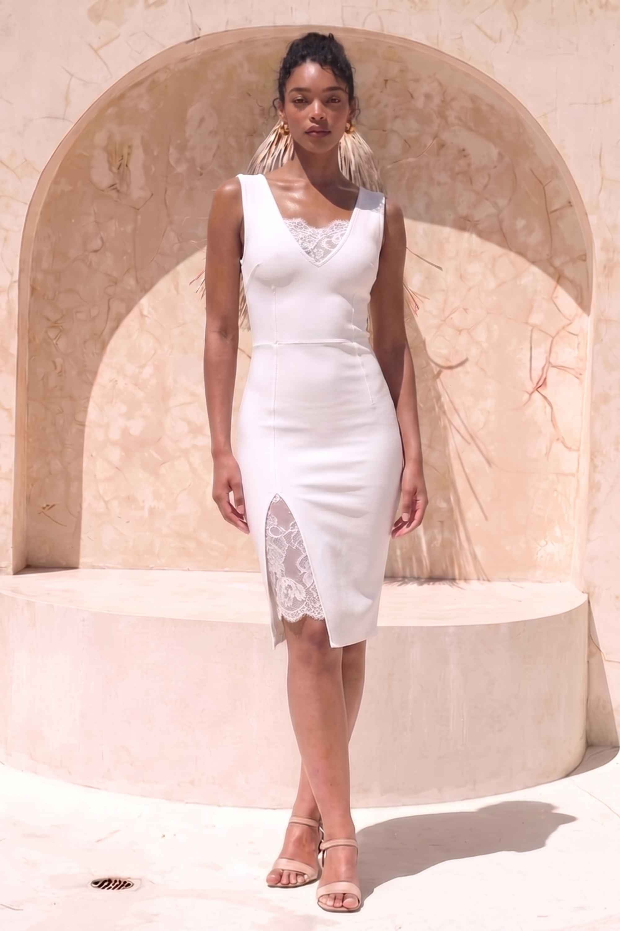 Woman wearing a figure flattering  Elsa Bodycon Dress - White Pearl BODYCON COLLECTION Pty Ltd
