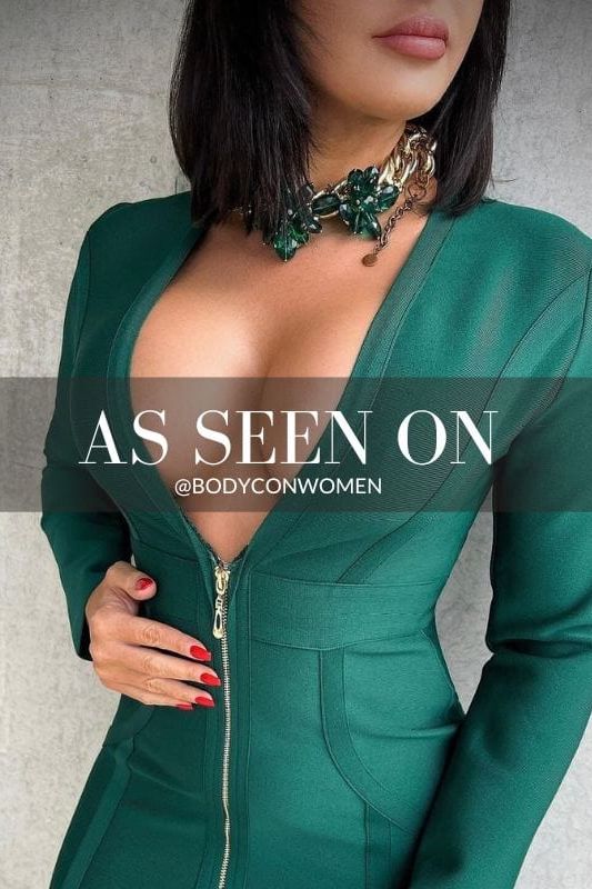 Woman wearing a figure flattering  Eva Long Sleeve Bandage Mini Dress - Emerald Green BODYCON COLLECTION