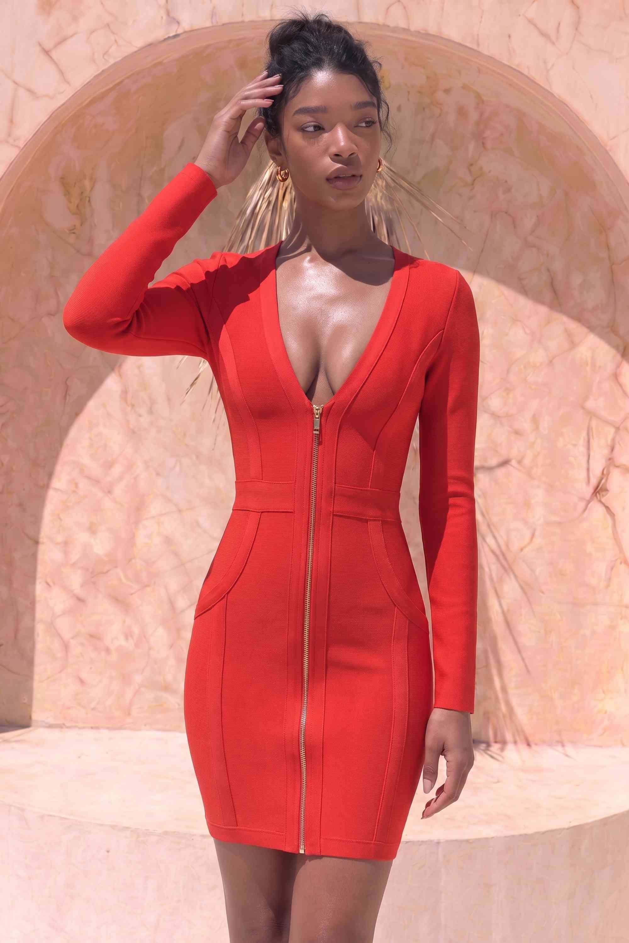 Woman wearing a figure flattering  Eva Long Sleeve Bandage Mini Dress - Lipstick Red BODYCON COLLECTION