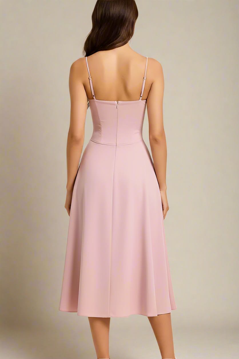 Woman wearing a figure flattering  Everly Midi Dress - Blush Pink BODYCON COLLECTION