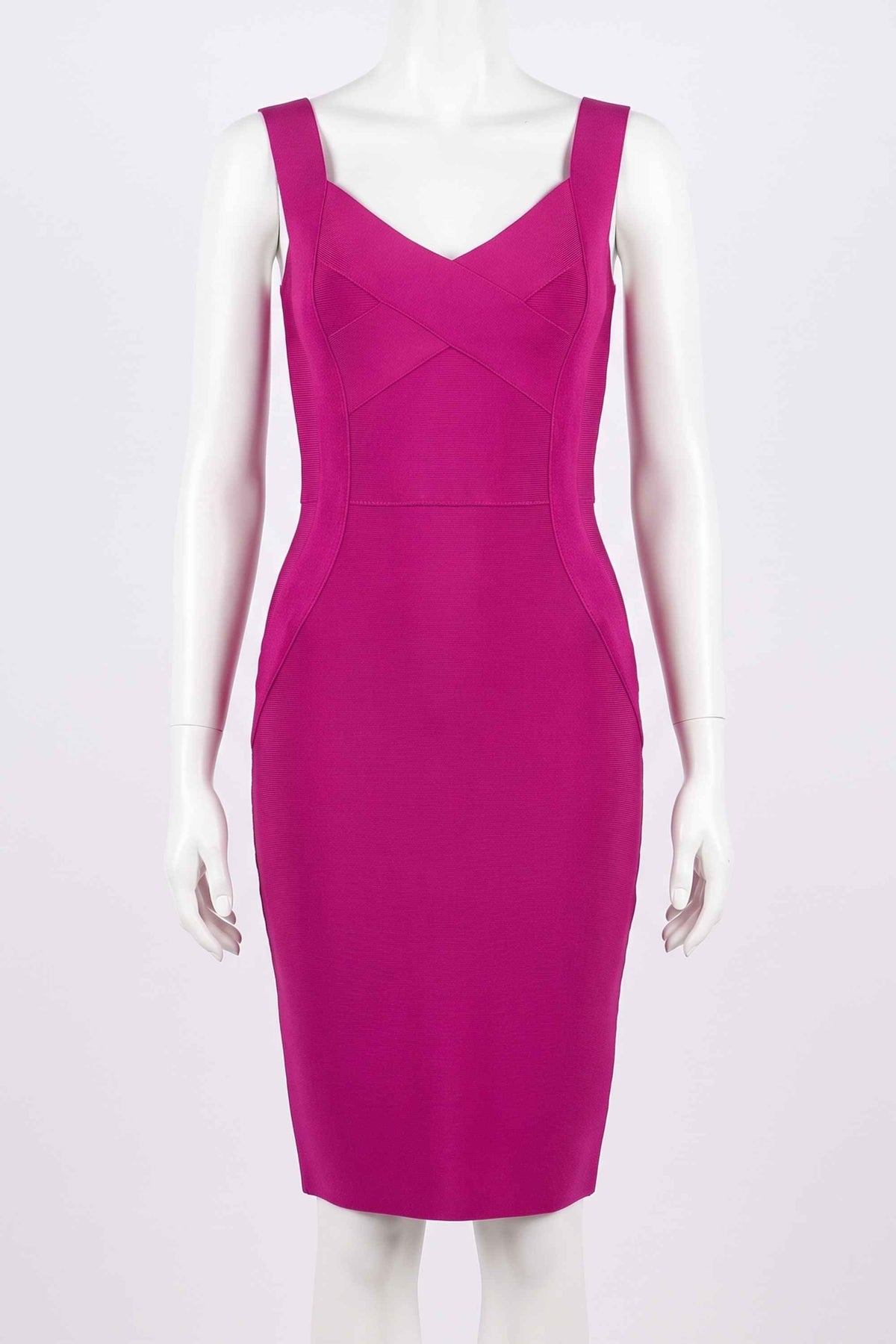 Woman wearing a figure flattering  Freya Bandage Dress - Magenta Pink BODYCON COLLECTION