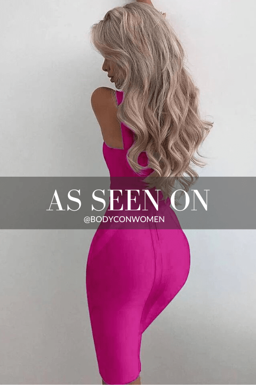 Woman wearing a figure flattering  Freya Bandage Midi Dress - Magenta Pink BODYCON COLLECTION