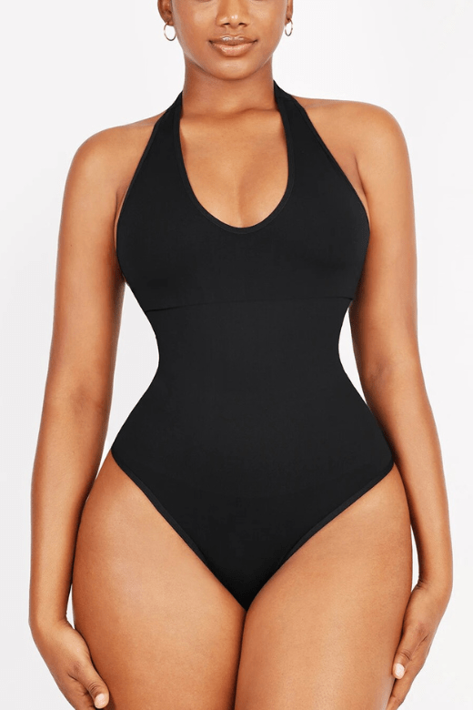 Woman wearing a figure flattering  Halter Neck One Piece Bodysuit Shapewear - Thong BODYCON COLLECTION