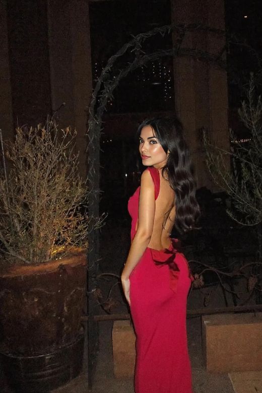 Woman wearing a figure flattering  Harper Bodycon Maxi Dress - Lipstick Red BODYCON COLLECTION