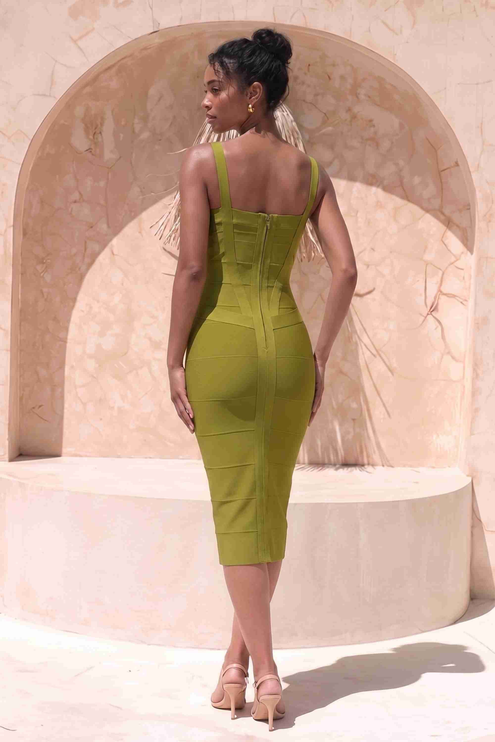 Woman wearing a figure flattering  Heidi Bandage Midi Dress - Olive Green Bodycon Collection