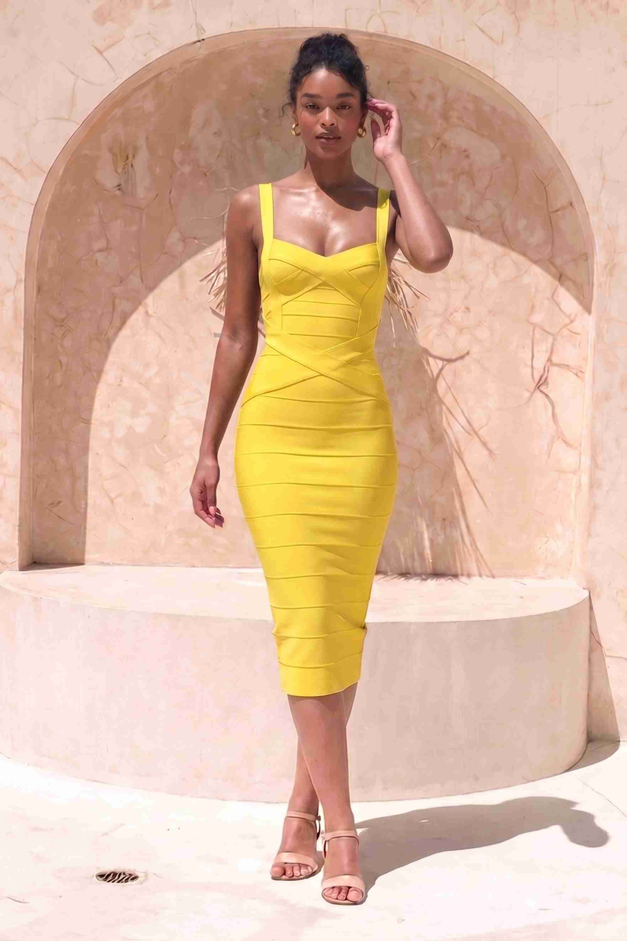 Woman wearing a yellow party dress  Heidi Bandage Midi Dress - Sun Yellow Bodycon Collection