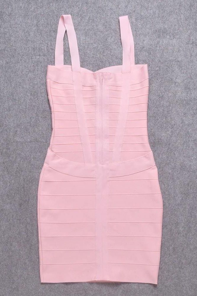 Woman wearing a figure flattering  Heidi Bandage Mini Dress - Dusty Pink Bodycon Collection