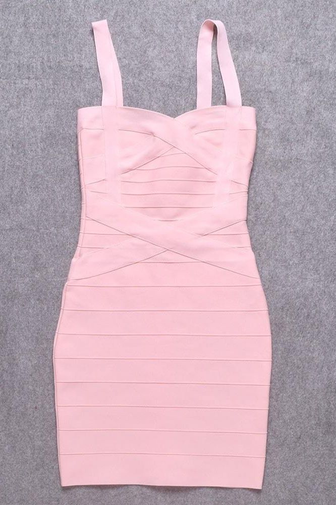 Woman wearing a figure flattering  Heidi Bandage Mini Dress - Dusty Pink Bodycon Collection