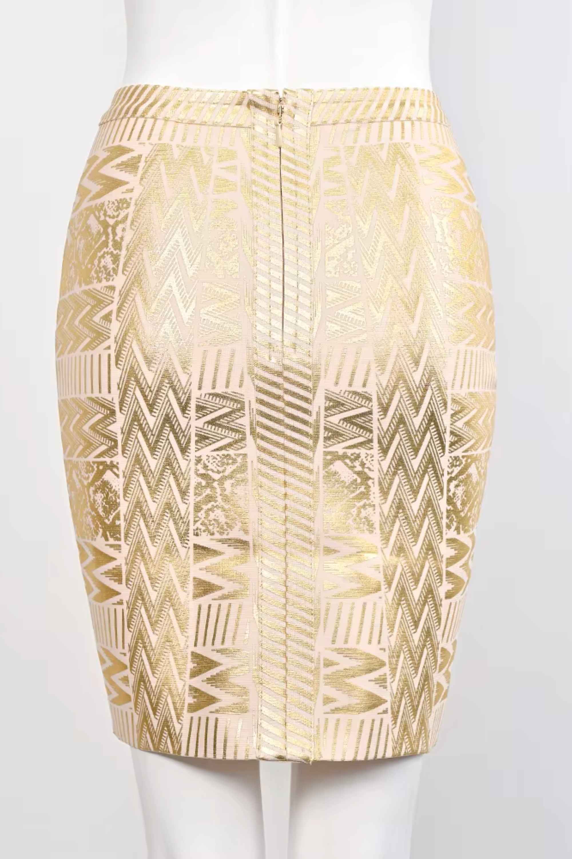 Woman wearing a figure flattering  High Waist Metallic Mini Skirt - Gold BODYCON COLLECTION