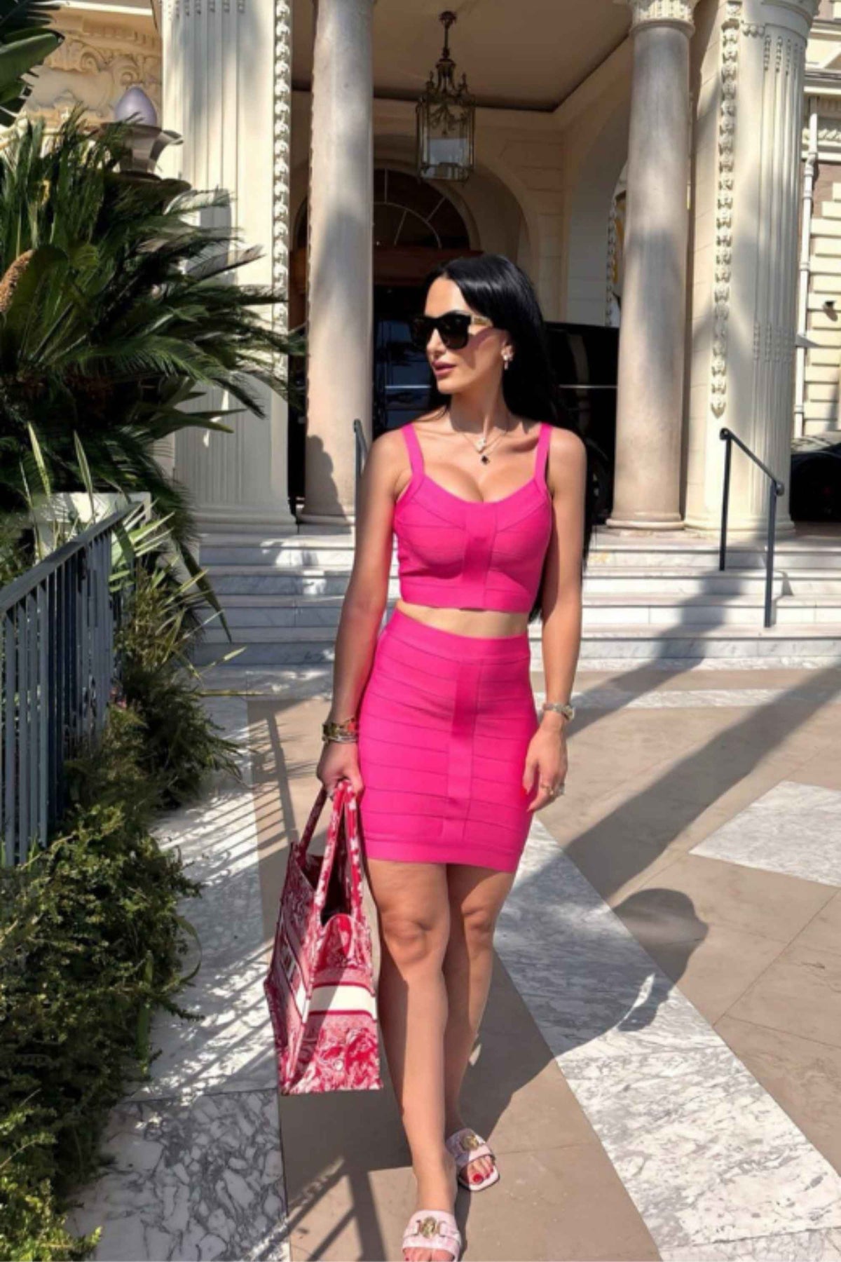Woman wearing a figure flattering  India Bandage Top and Mini Skirt Set - Hot Pink BODYCON COLLECTION