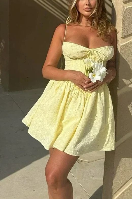 Woman wearing a figure flattering  Indiana Bodycon Mini Dress - Sun Yellow BODYCON COLLECTION