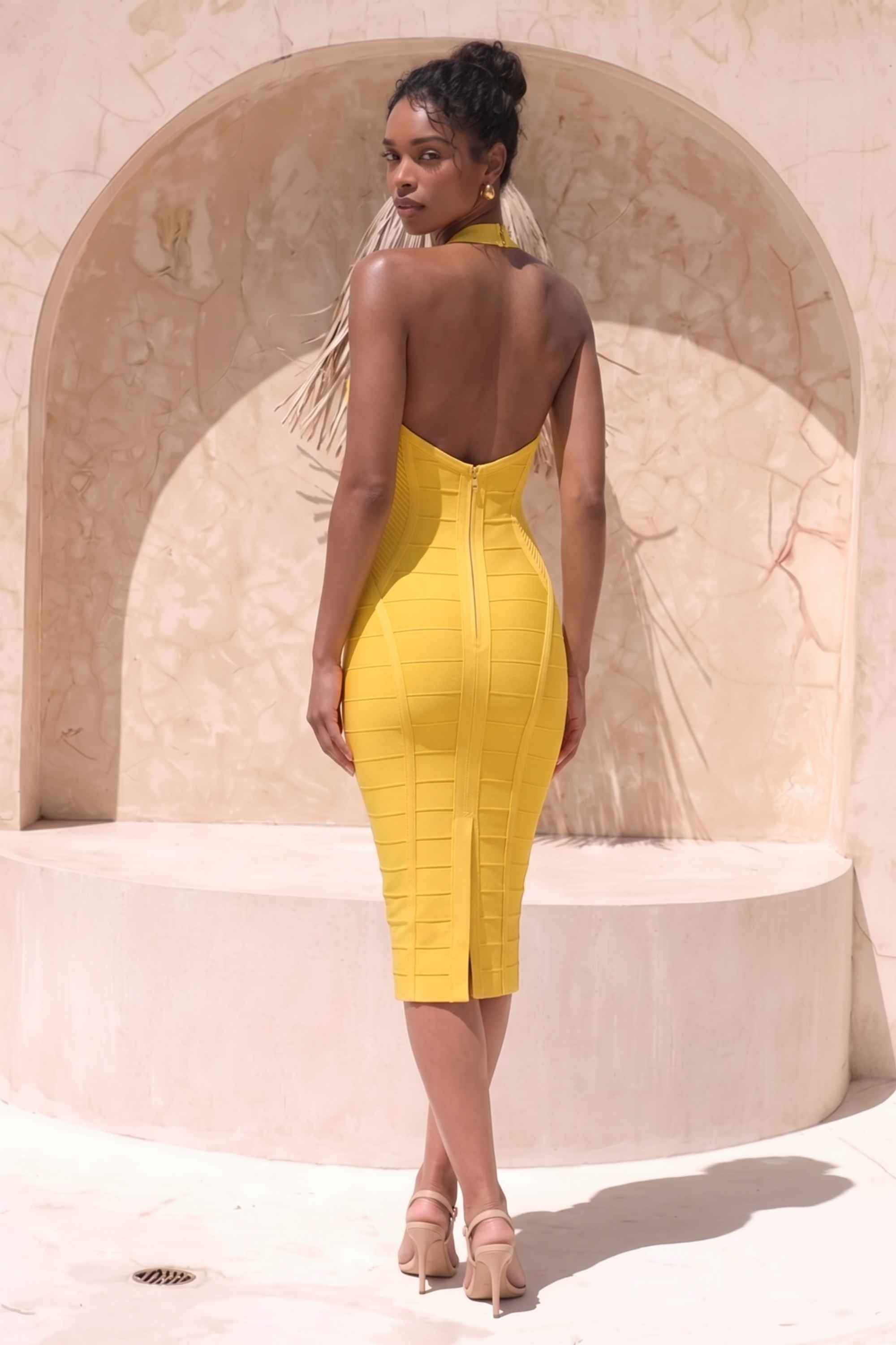 Woman wearing a figure flattering  Isabella Bandage Midi Dress - Mustard Yellow BODYCON COLLECTION Pty Ltd
