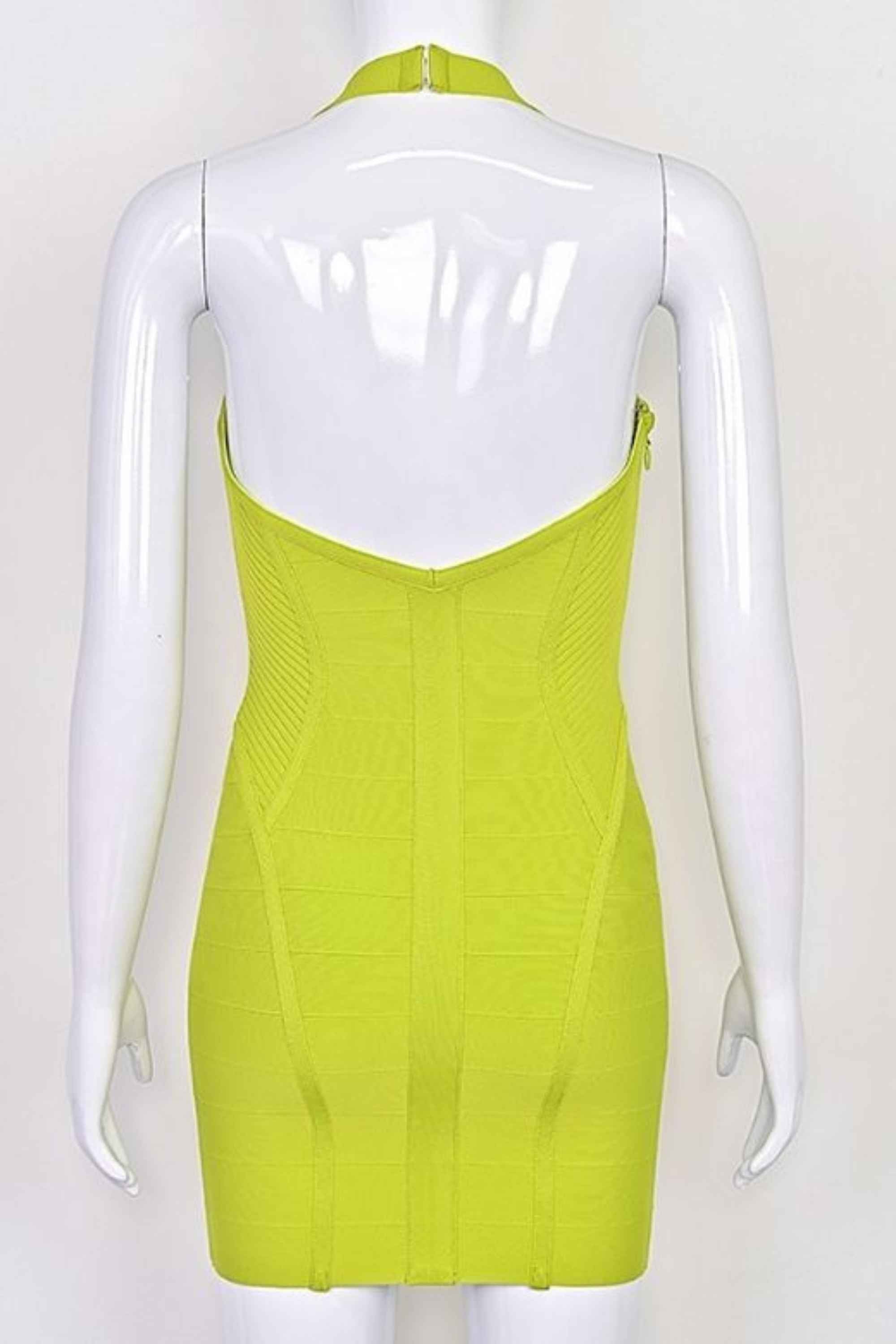 Woman wearing a figure flattering  Isabella Bandage Mini Dress - Neon Green BODYCON COLLECTION Pty Ltd