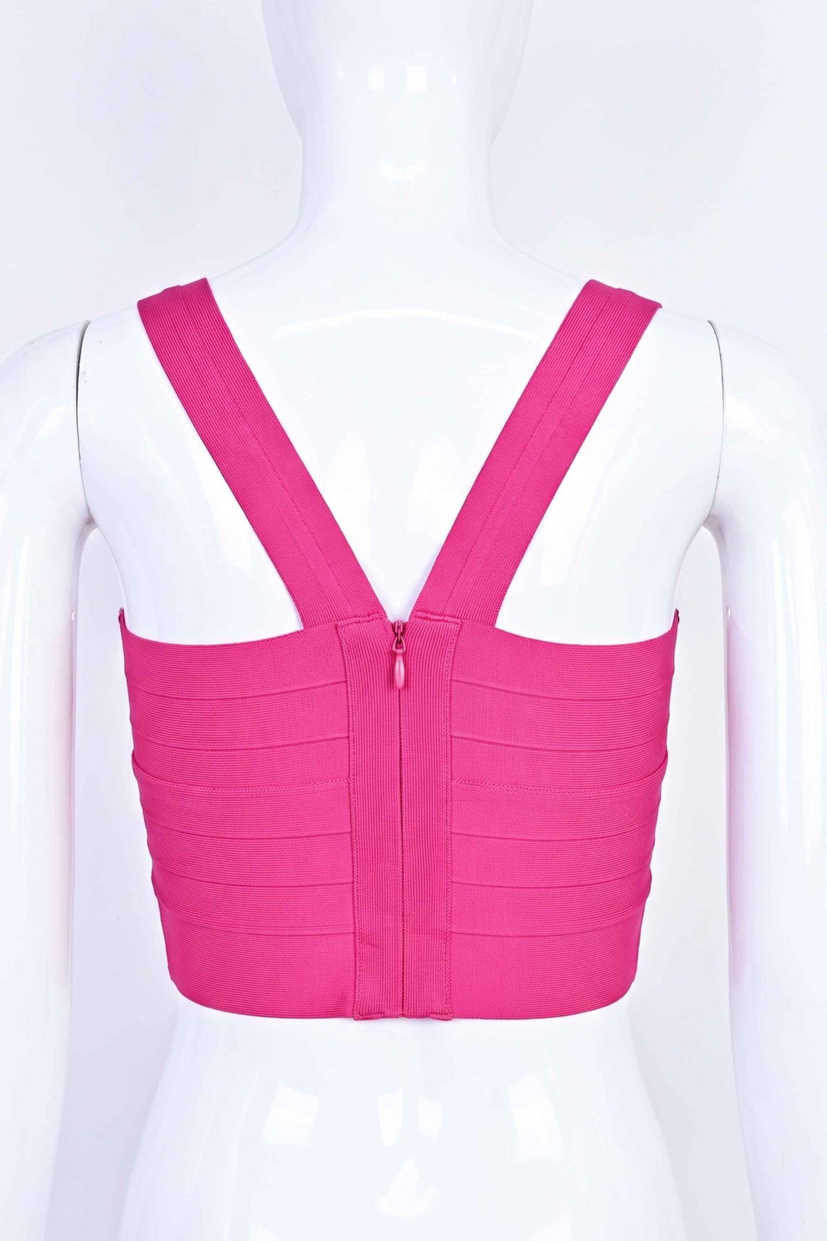 Woman wearing a figure flattering  Jay Bandage Crop Top - Hot Pink BODYCON COLLECTION