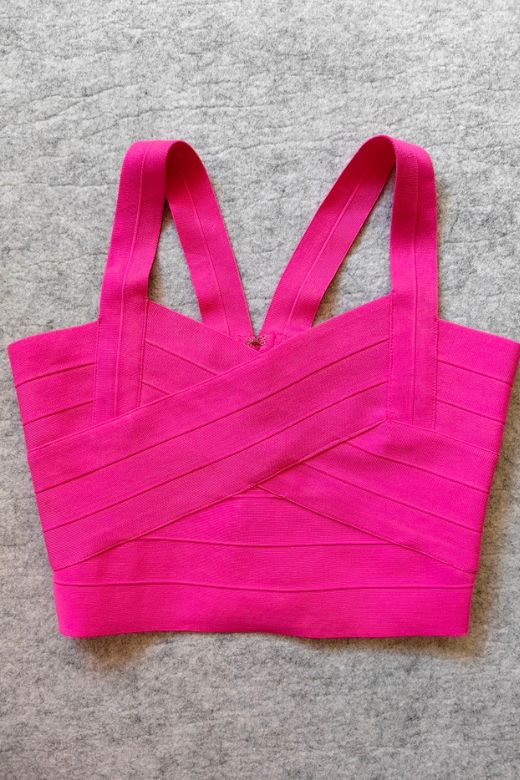 Woman wearing a figure flattering  Jay Bandage Crop Top - Hot Pink BODYCON COLLECTION