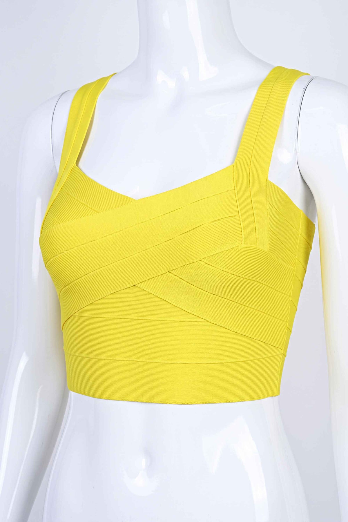 Woman wearing a figure flattering  Jay Bandage Crop Top - Sun Yellow BODYCON COLLECTION
