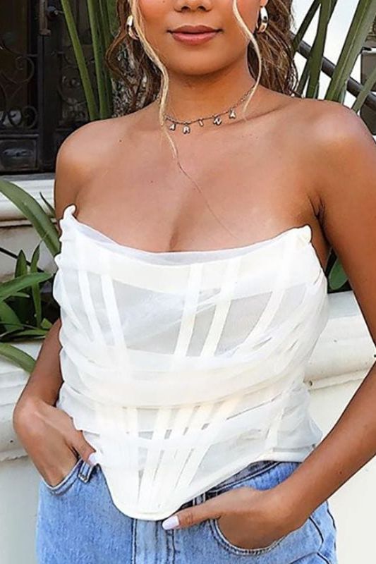 Woman wearing a figure flattering  Jen Mesh Bustier Top - Pearl White BODYCON COLLECTION