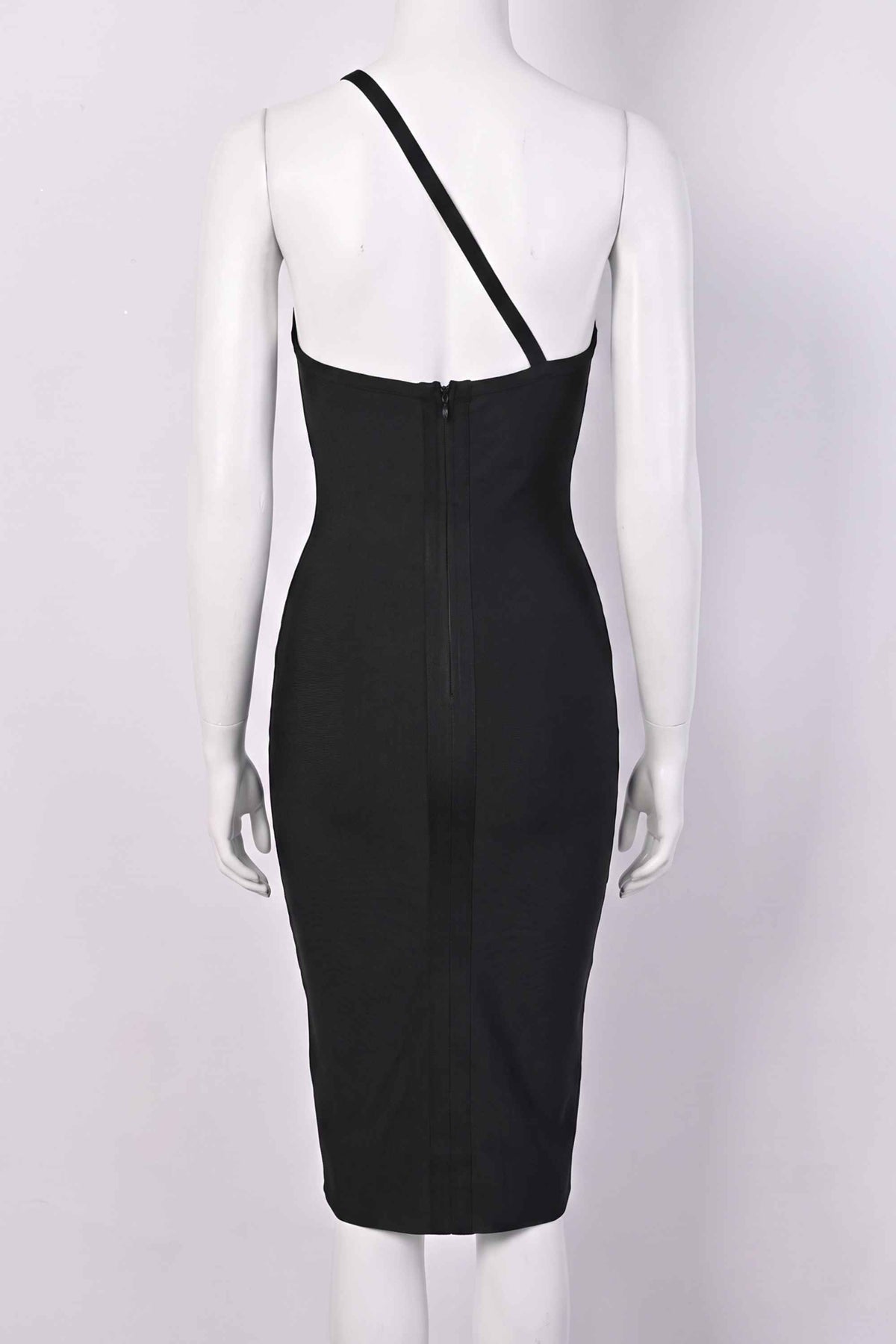 Woman wearing a figure flattering  Joi Bodycon Midi Dress - Classic Black Bodycon Collection