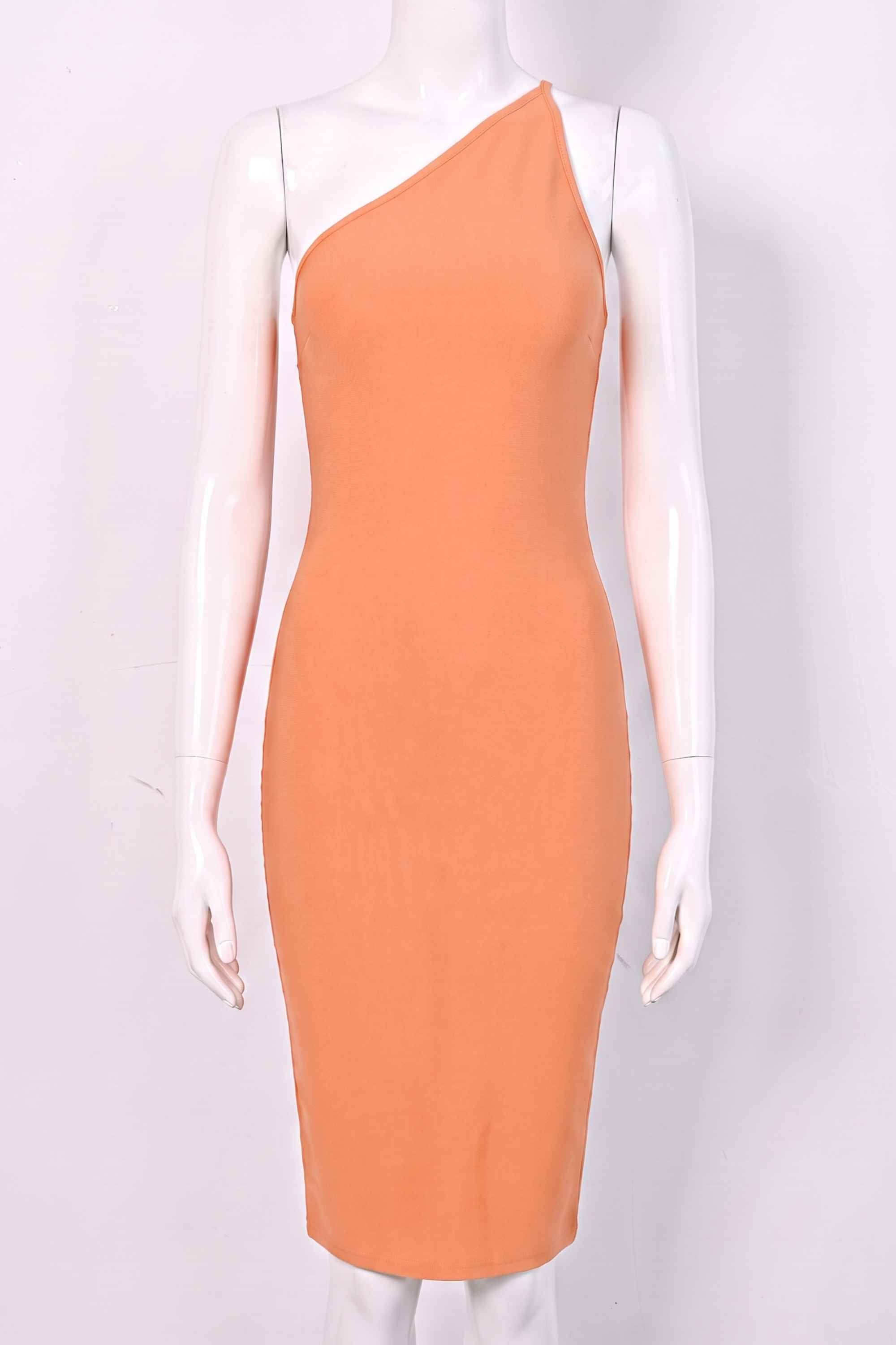 Woman wearing a figure flattering  Joi Bodycon Midi Dress - Peach Bodycon Collection