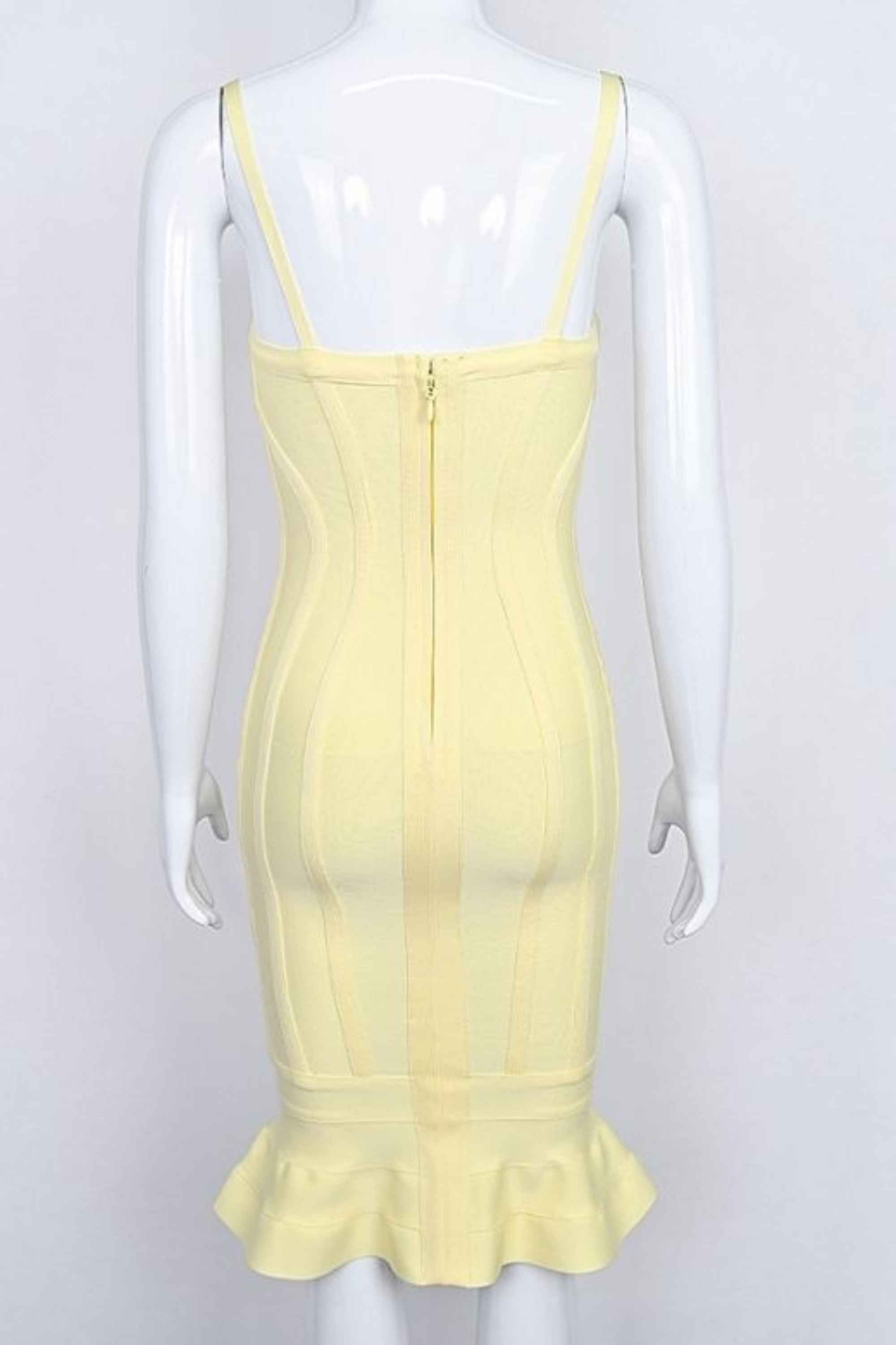 Woman wearing a figure flattering  Joy Bandage Midi Dress - Sun Yellow Bodycon Collection